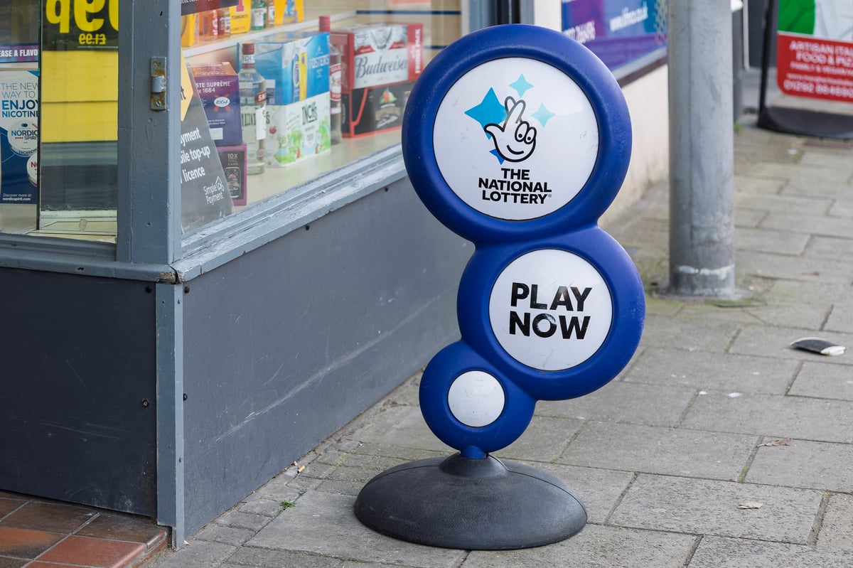 The National Lottery Blue and white free standing sign outside local convenience store